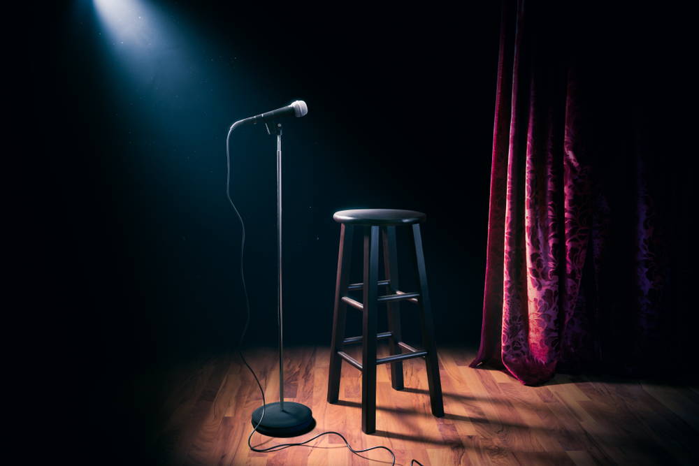 comedian's stool and microphone on stage