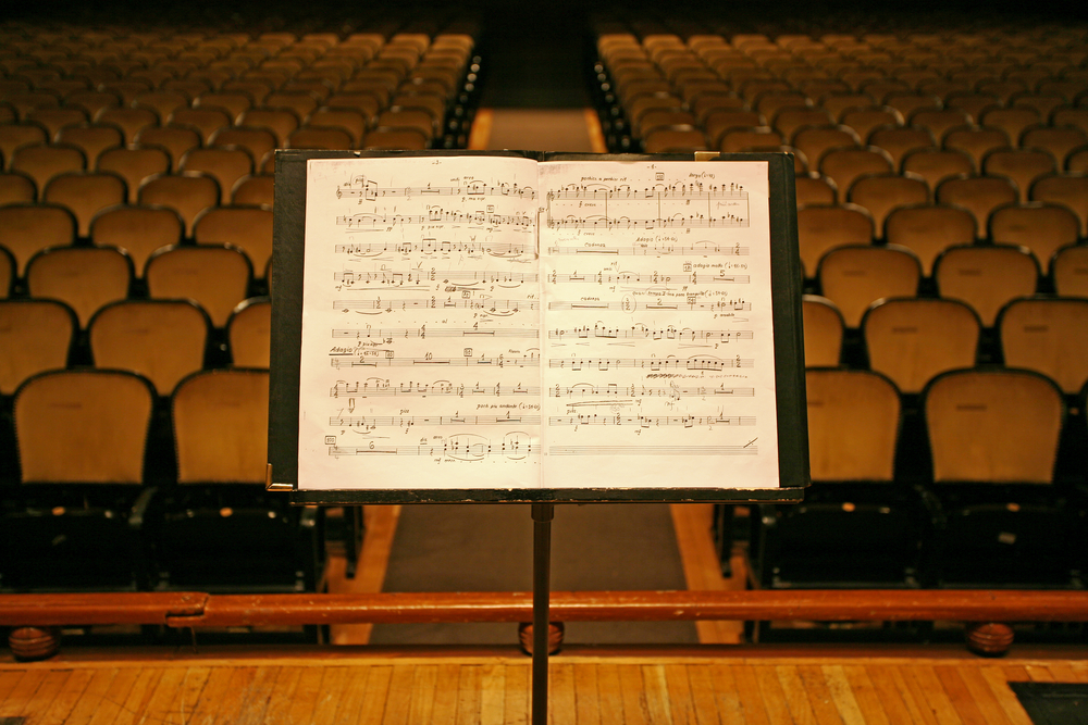 music stand in front of auditorium seats
