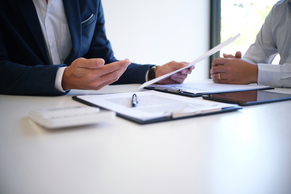 lawyer speaking with a client