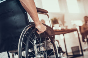 Man in a wheelchair at an office