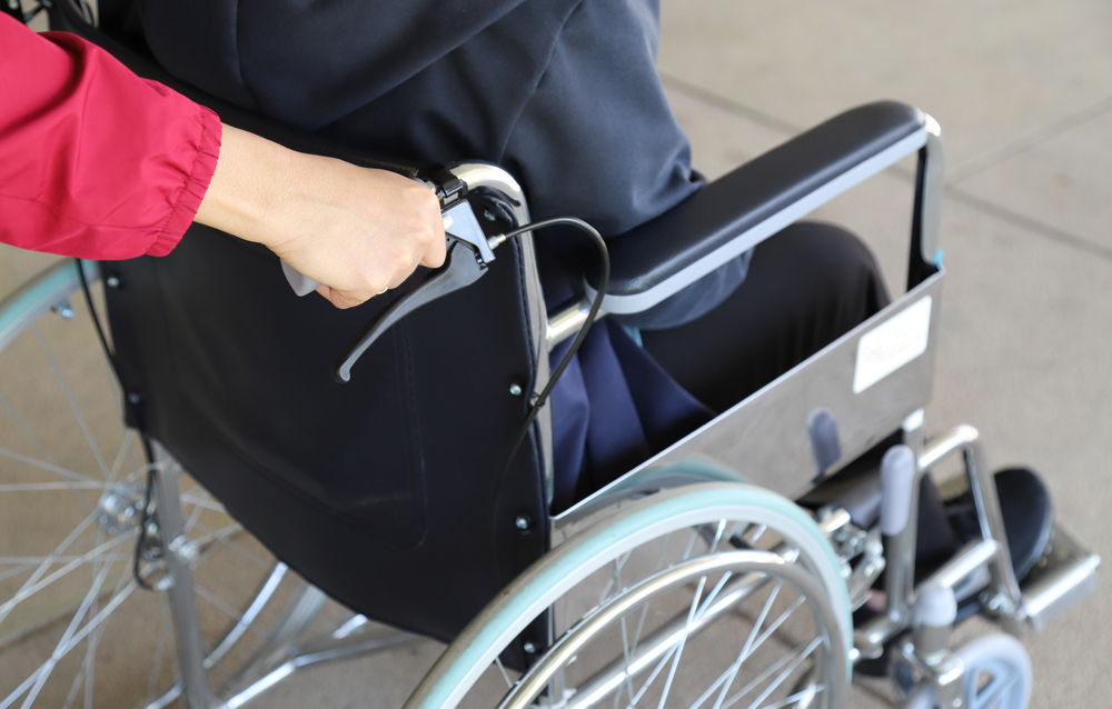 person being pushed in a wheelchair